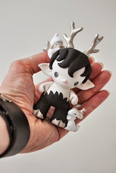 Munny faun in black with elf and jackalope bunny in hand